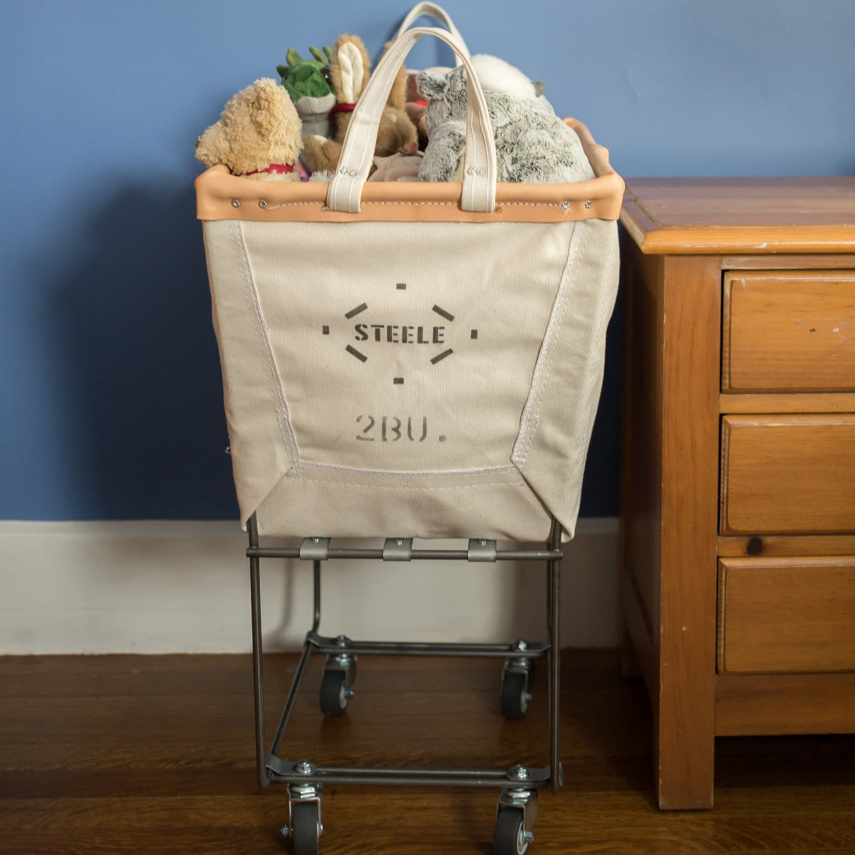 canvas laundry truck holding stuffed animals