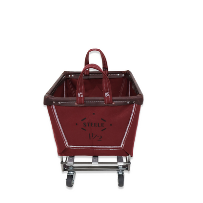 Red shopping cart with 'Steele' branding on a white background