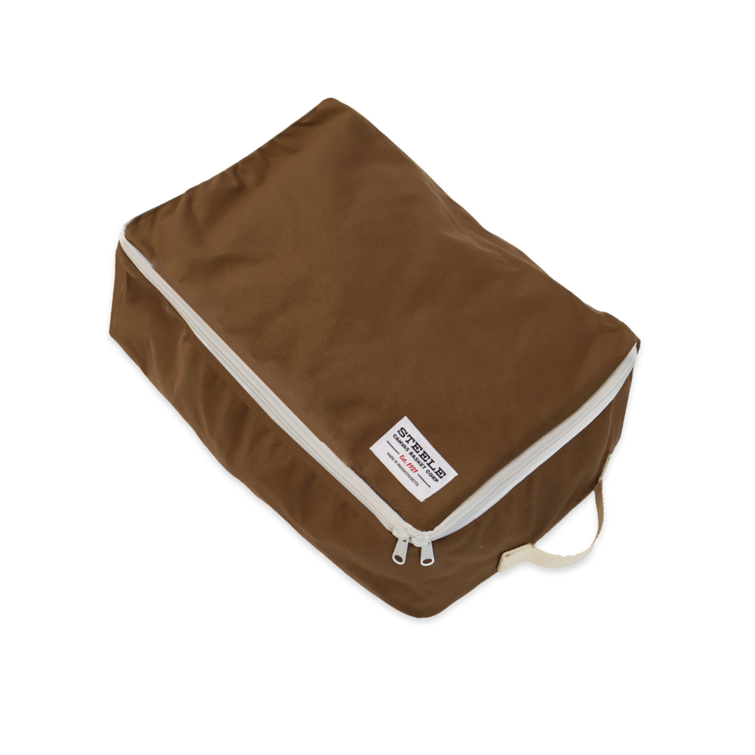 A brown rectangular zippered travel organizer bag with a white zipper trim and a small white brand label, shown on a plain white background.