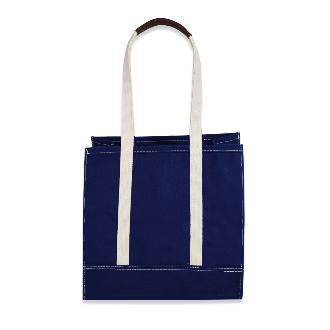 Navy blue tote bag with white handles on a white background