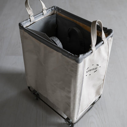 side angle of a laundry hamper with a vinyl liner inside