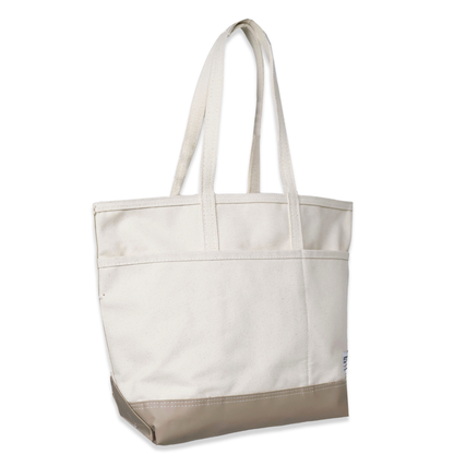 White tote bag with beige bottom section on a white background