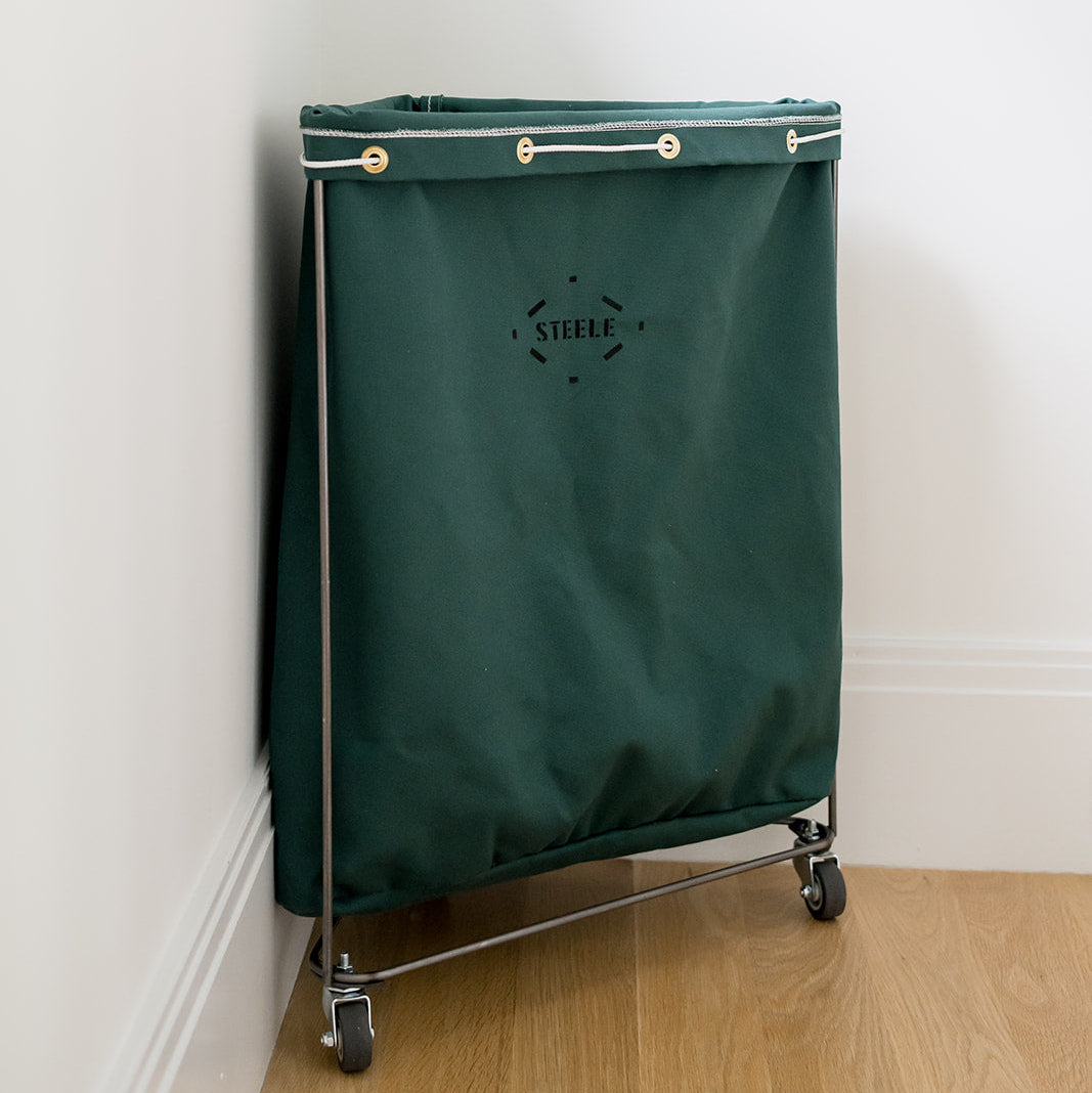 corner laundry basket in a hunter green color