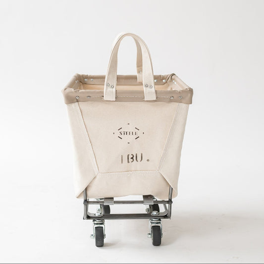 Cart with a beige bag on wheels against a white background