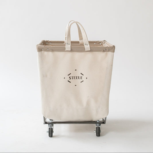 Beige laundry basket with wheels and handles on a white background