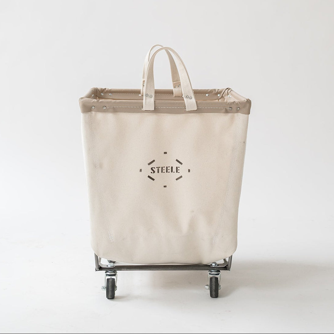 Beige laundry basket with wheels and handles on a white background