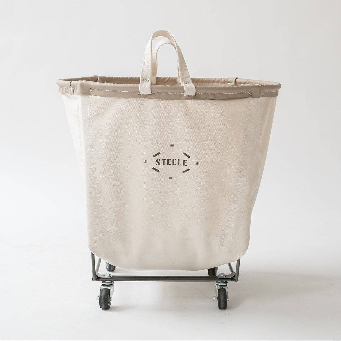 Beige laundry basket with wheels on a white background