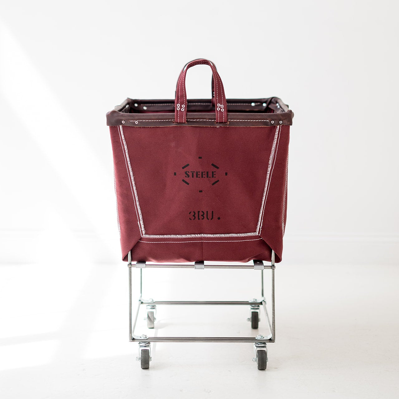 auburn laundry cart with a visible brand logo on a white background