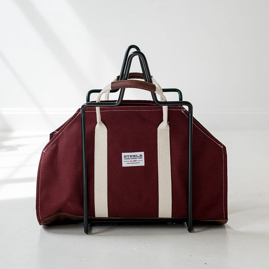 Maroon log carrier with white stripes and a visible brand label on a white background