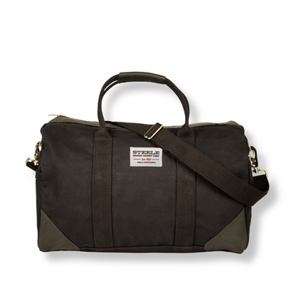 Brown duffel bag with a strap on a white background