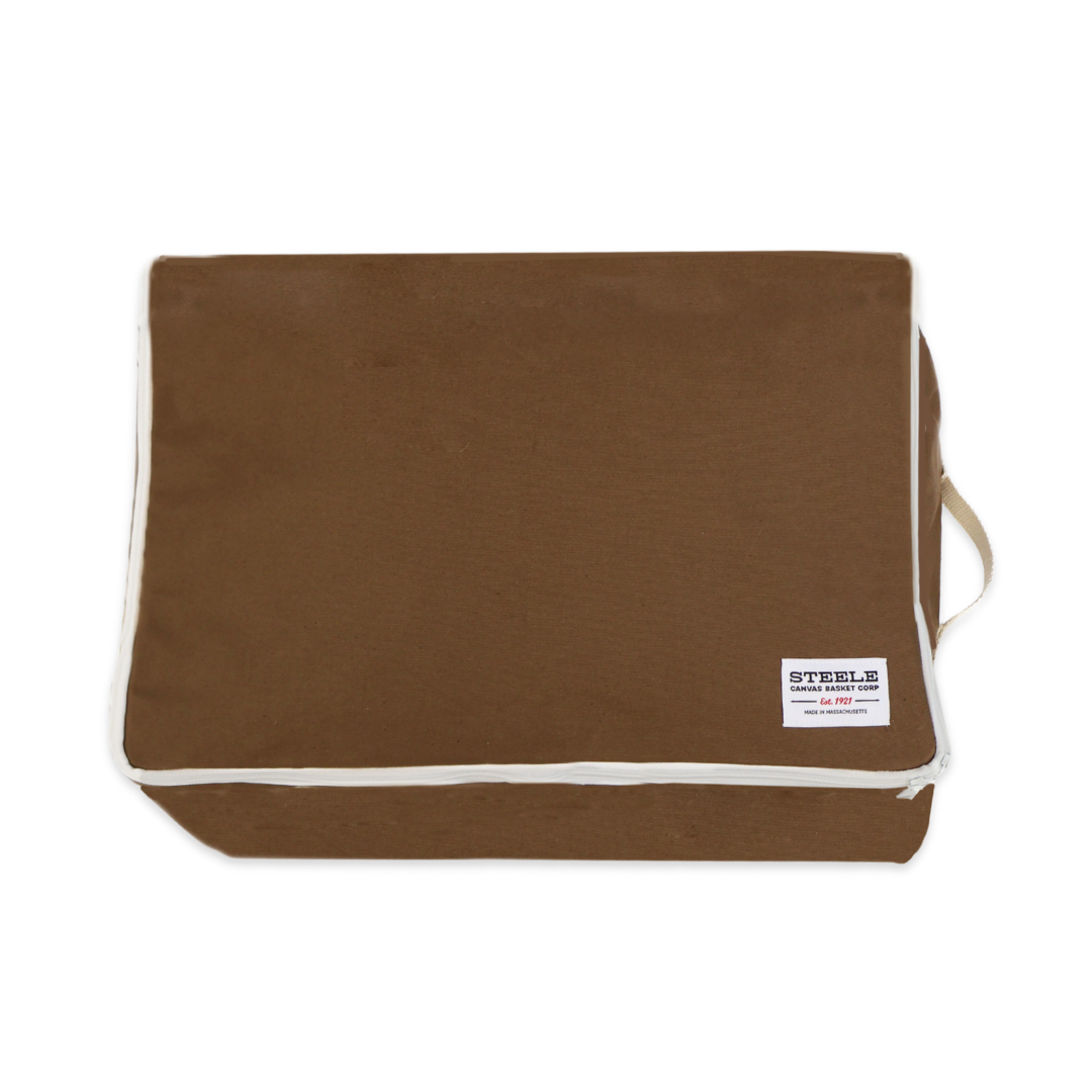 A brown canvas storage pouch with white piping and a small white brand label on the bottom right, shown against a plain white background.